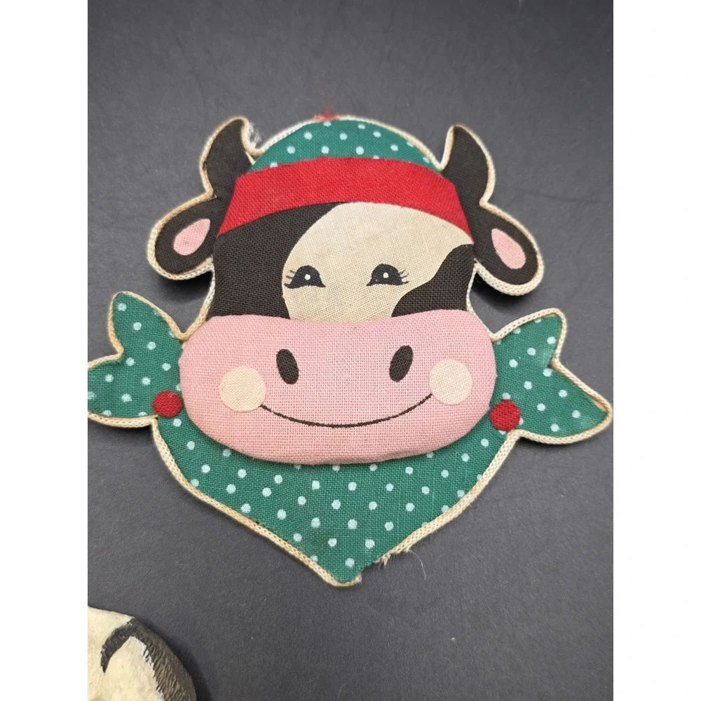 This collection features various vintage-style cow refrigerator magnets
